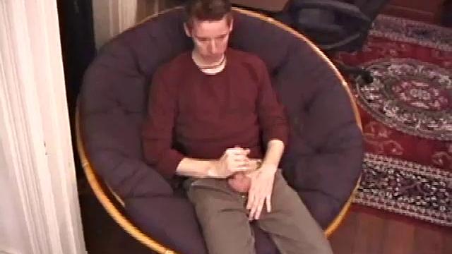 Jonathan Star plays with his dick in jockstrap, sheds clothes, lubes up, strokes cock with determination, teases nipples, edges closer, erupts in hand