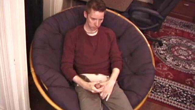 Jonathan Star plays with his dick in jockstrap, sheds clothes, lubes up, strokes cock with determination, teases nipples, edges closer, erupts in hand