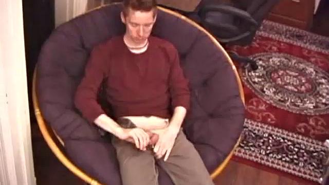 Jonathan Star plays with his dick in jockstrap, sheds clothes, lubes up, strokes cock with determination, teases nipples, edges closer, erupts in hand