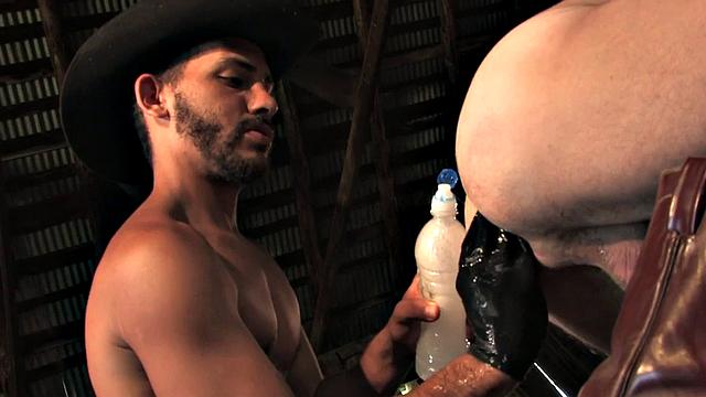 Kinky Latino stud fists tattooed MILF's ass after deepthroating a stiff one