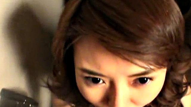Sexy Japanese MILF sucking on a cock
