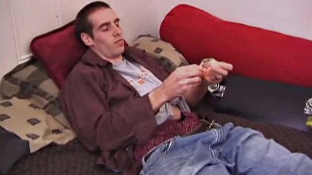 There's some good porn playing on the TV, so James Shafer decides to jack off. He pulls out his pierced dick and strokes it with determination, until he blows his warm cum load.
