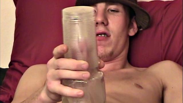 Dean is a smooth young man, with a big cock. It doesn't take him long to get naked and bone up, before grabbing a fleshlight and sliding it over his stiff meat. He fucks that sex toy all over the bed, until it takes him over the edge.