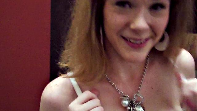 Get a POV view of a brown-haired babe getting her nipples sucked in a store