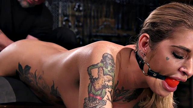 Kinky tattooed slut dominated and whipped with toys by dominant guy