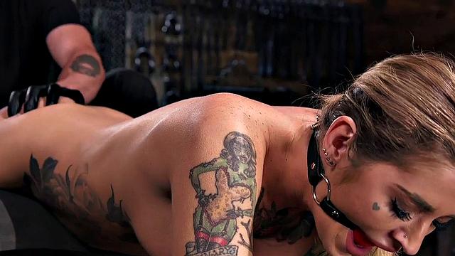 Kinky tattooed slut dominated and whipped with toys by dominant guy
