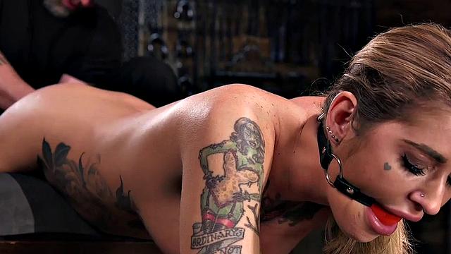 Kinky tattooed slut dominated and whipped with toys by dominant guy