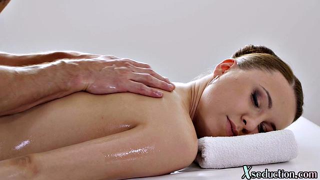 Cute oiled babe bounces on masseur's cock