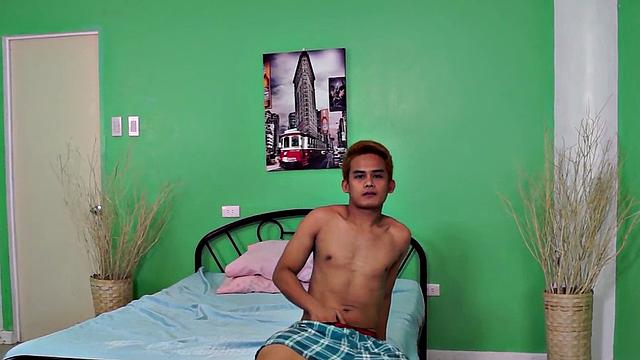 Solo Asian twink jerks cock at home till cumshot