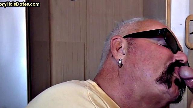Gay Daddy adores sucking gloryhole penis at his home