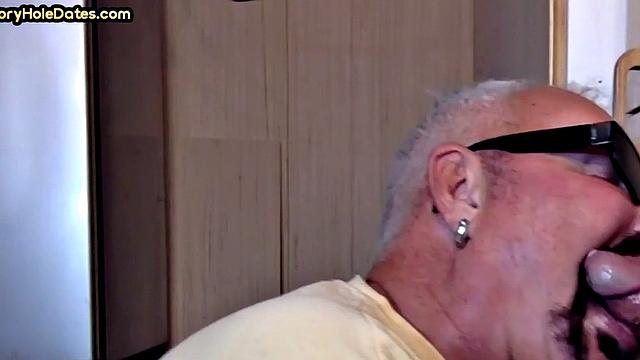 Gay Daddy adores sucking gloryhole penis at his home