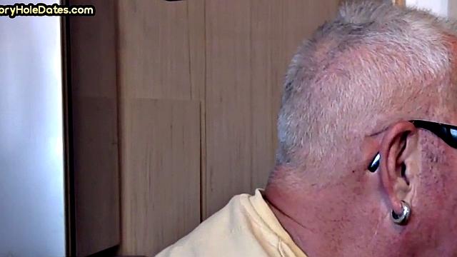 Gay Daddy adores sucking gloryhole penis at his home
