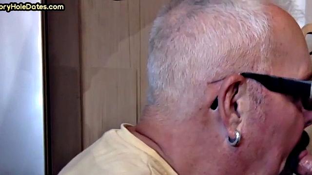 Gay Daddy adores sucking gloryhole penis at his home