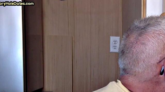 Gay Daddy adores sucking gloryhole penis at his home