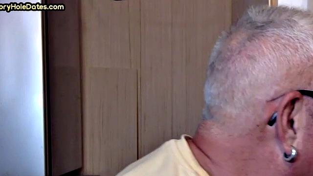 Gay Daddy adores sucking gloryhole penis at his home