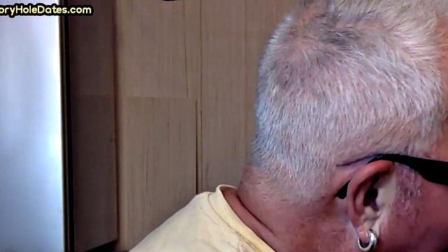 Gay Daddy adores sucking gloryhole penis at his home