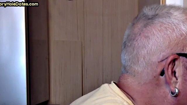 Gay Daddy adores sucking gloryhole penis at his home