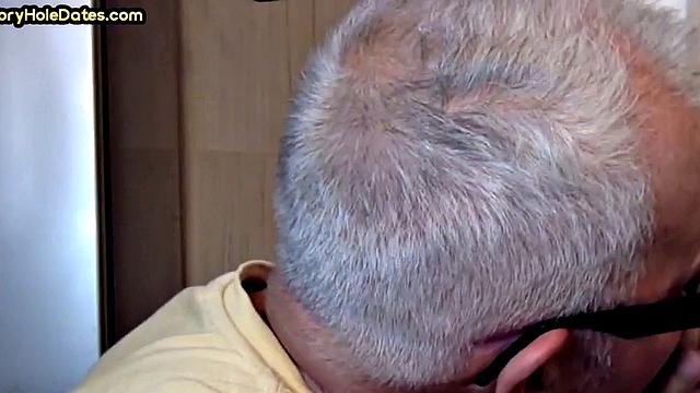 Gay Daddy adores sucking gloryhole penis at his home