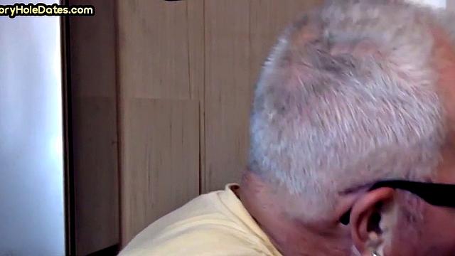 Gay Daddy adores sucking gloryhole penis at his home