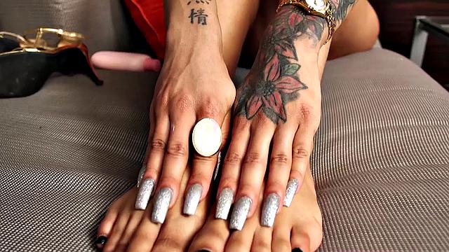 Watch this big-titted ebony babe flaunt her feet in lingerie & give a smoking hot handjob