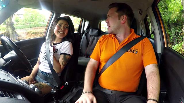 Naughty Asian teen with glasses gets her tight pussy drilled by her instructor in car