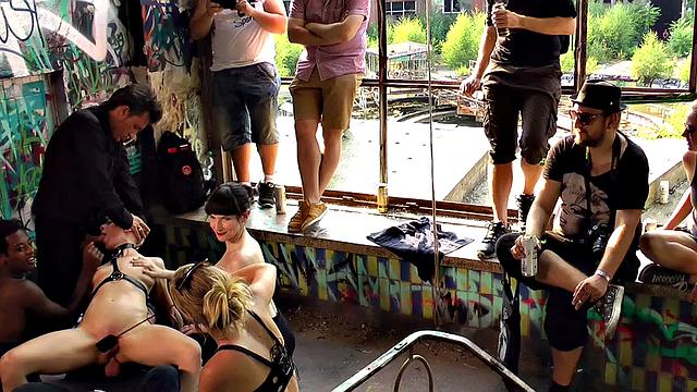 BDSM babe anally drilled and spanked by crowd in public