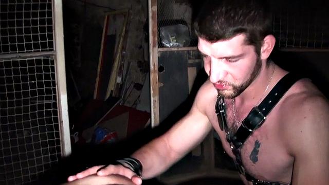 Submissive gay fucked in basement by jock in harness