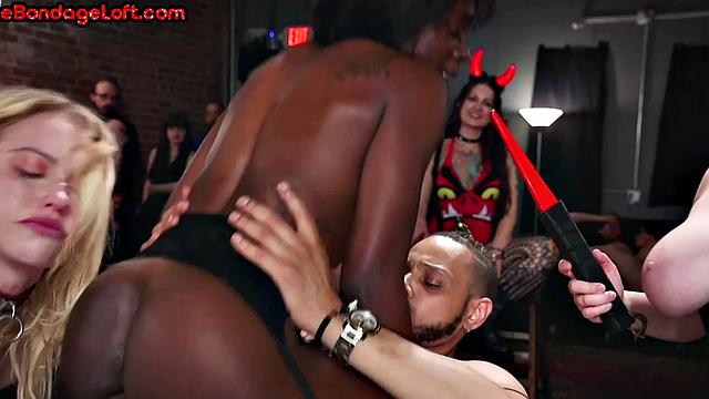 Rimmed Ebony gets electrosex in BDSM public group sess