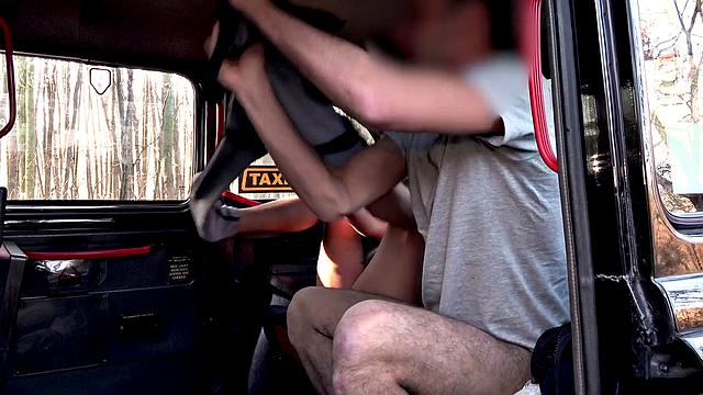 A busty babe's natural boobs bounce in a taxi ride