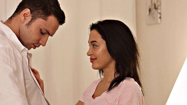 Hot couple turns chair into bed