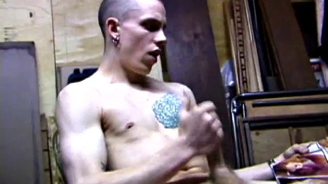 Returning home from work, Shane grabs a porn magazine and heads for the garage. There, he strokes his hard cock, while eating his pre-cum, and then pumps onto his belly.