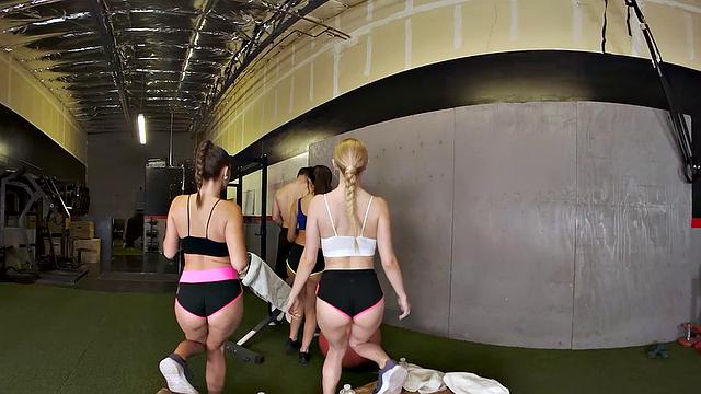 Big dick hunk takes on three petite co-ed hotties in the gym