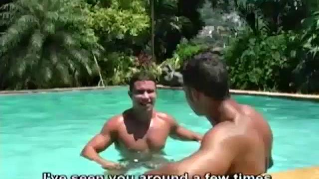 Ramon is alone in the pool doing power laps when Rodrigo jumps in. The two big dicked muscle hunks affectionately pose, and kiss, before moving behind a hidden statue nook.