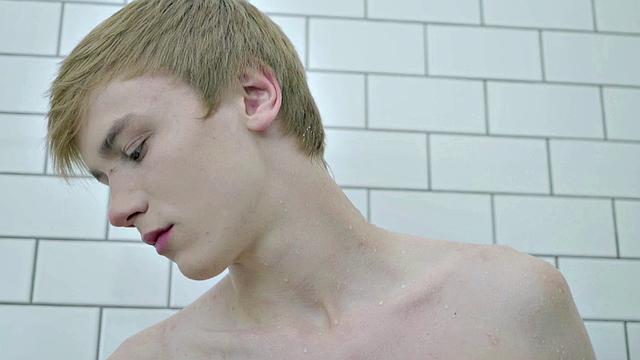 Young skinny guy masturbates in bathroom while tugging on his big hard cock