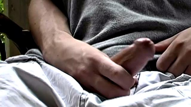 Adorable 18 year old Donavin Fitch finds himself alone at the country cabin and horny. On the porch, he parks himself in a chair and pulls out his growing dick.