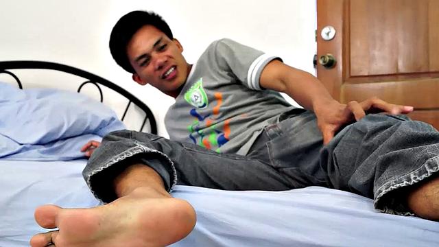 The gorgeous gay Asian twink Argie shows off his beautiful Asian boy feet for you