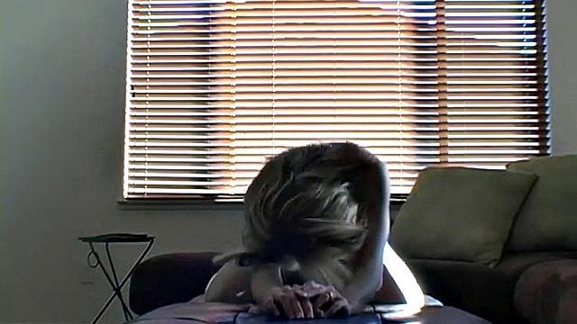 Stripteasing teen opens her skinny legs wide