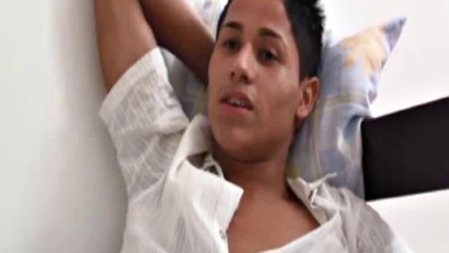 Martino Paiva and Nuno Santos in bed for a romp. They aren't hard for long before Josue Otaviano joins. He gets his big black cock out for them.