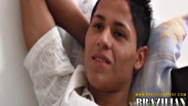 Martino Paiva and Nuno Santos in bed for a romp. They aren't hard for long before Josue Otaviano joins. He gets his big black cock out for them.