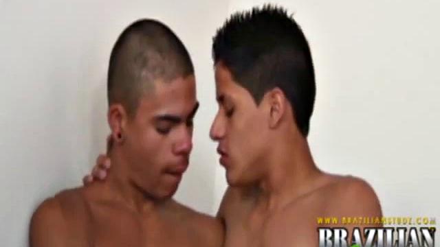 Martino Paiva and Nuno Santos in bed for a romp. They aren't hard for long before Josue Otaviano joins. He gets his big black cock out for them.