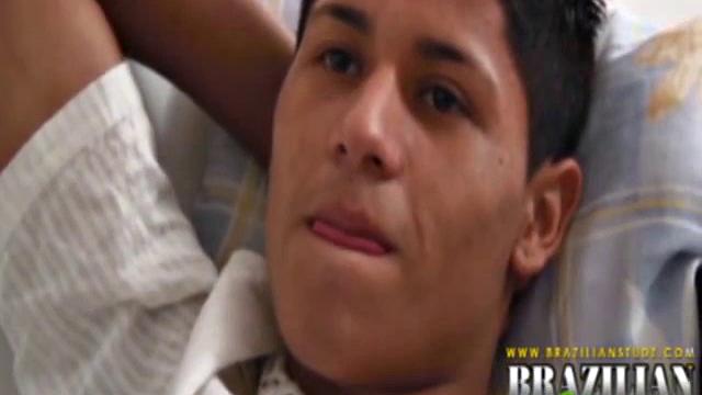 Martino Paiva and Nuno Santos in bed for a romp. They aren't hard for long before Josue Otaviano joins. He gets his big black cock out for them.