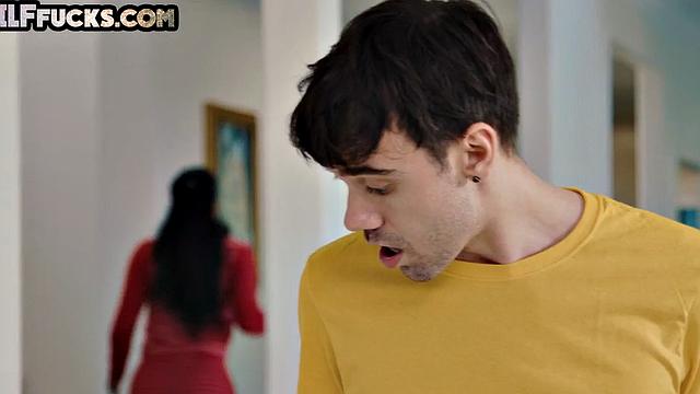 Busty GILF with huge tits bounces on young dick