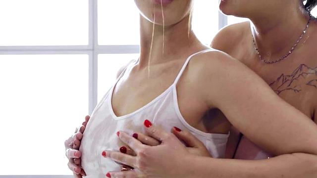 Oiled lesbians enjoy fingering on massage table