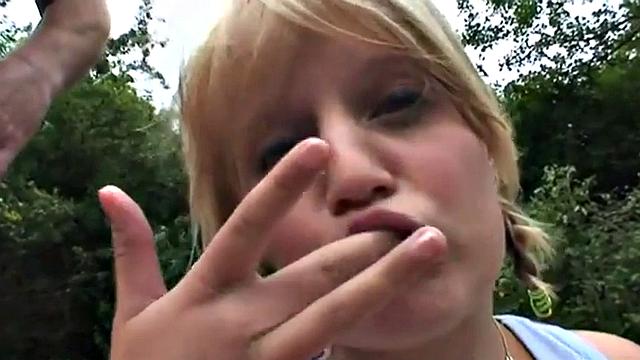 Young blonde teen gets down & dirty with an older guy in public