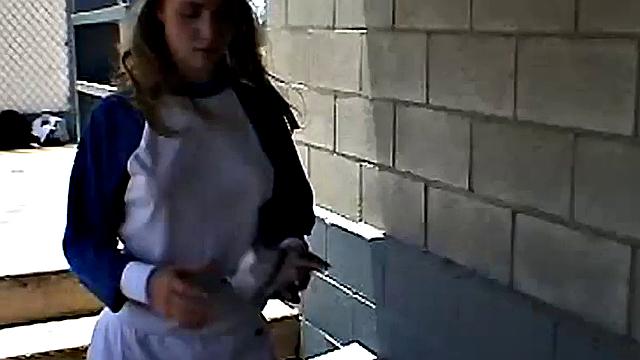 Little April rubs her pussy at the baseball field