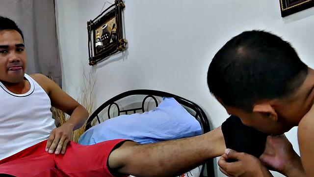These two Asian twinks love male feet. They could not wait to lick, suck toes, and sniff feet. The two Asian boys submerge themselves in foot worship action, heating the room up.