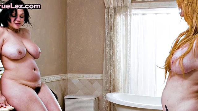 Pussytoying ginger MILF pleases her GF in bathroom