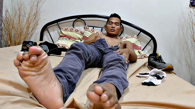 Joshua is a kinky Asian boy who gets off on male feet. He just got home from a long day at work, and nothing turns him on more than the sweet aroma of his Asian boy feet that have spent all day penned up in his shoes.