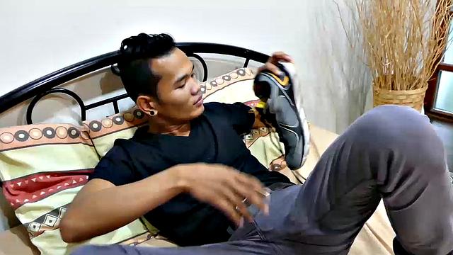 Joshua is a kinky Asian boy who gets off on male feet. He just got home from a long day at work, and nothing turns him on more than the sweet aroma of his Asian boy feet that have spent all day penned up in his shoes.