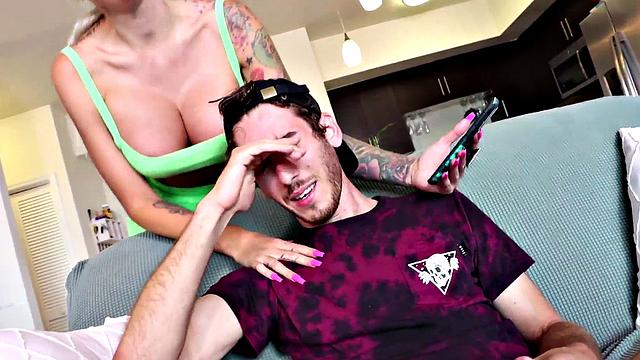 Busty amateur MILF with tattoos jerks stud cock